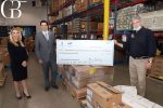 Lauren amico reed and hector salazar of la jolla cosmetic surgery centre present a 000 check to san diego food bank ceo jim floros