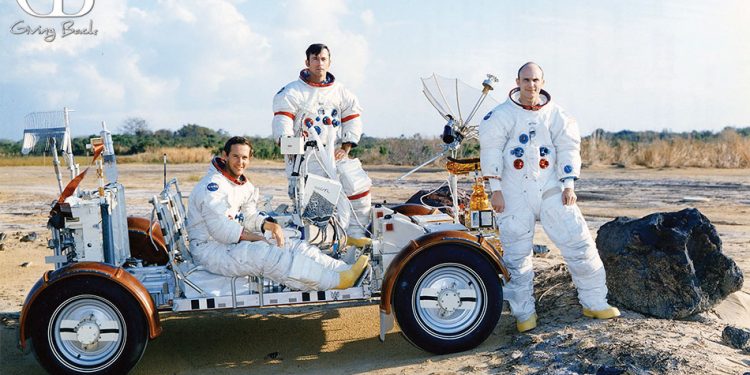 Charlie duke john young and ken mattingly pose with a lunar rover at the kennedy space center