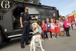 Sdpd police officers with young community members and a mobile odor detection canine for safety for all series