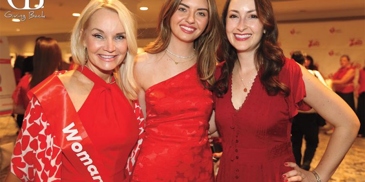 Three Women in Red Dress at American Heart Association of San Diego Hosted a Go Red for Women Luncheon Event