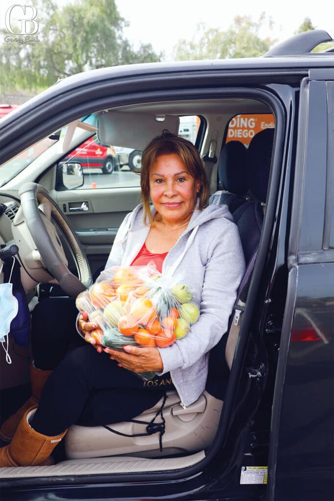 Feeding San Diego food recipient Eulalia receives fresh produce