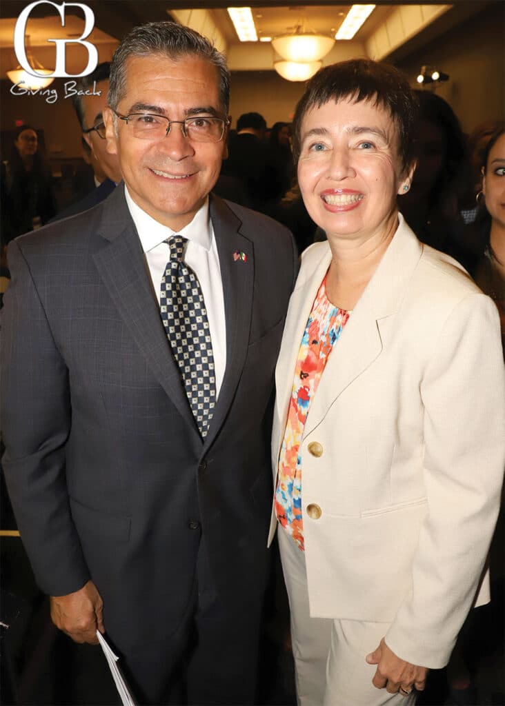 Secretary of the Department of Health and Human Services Xavier Becerra and Adama Dyoniziak