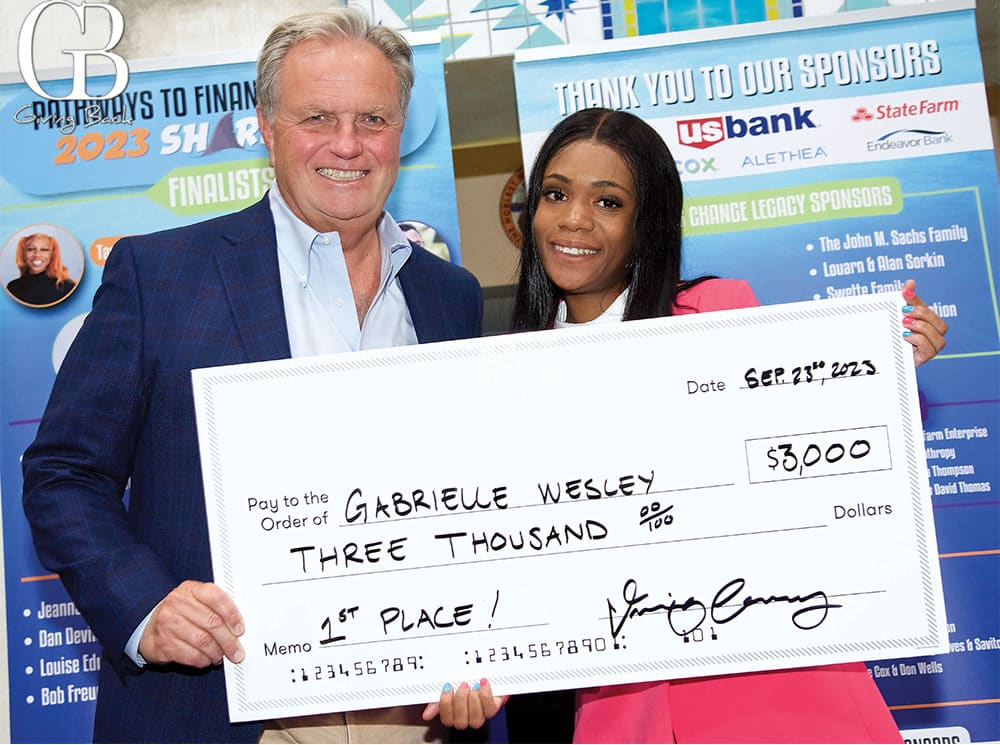 Shark Tank winner Gabrielle Wesley with Coach Dan Devine
