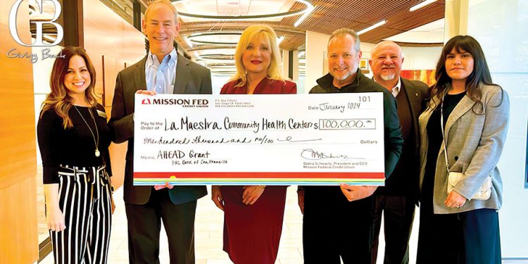 Doug wright presents 0000 grant to la maestra community health centers