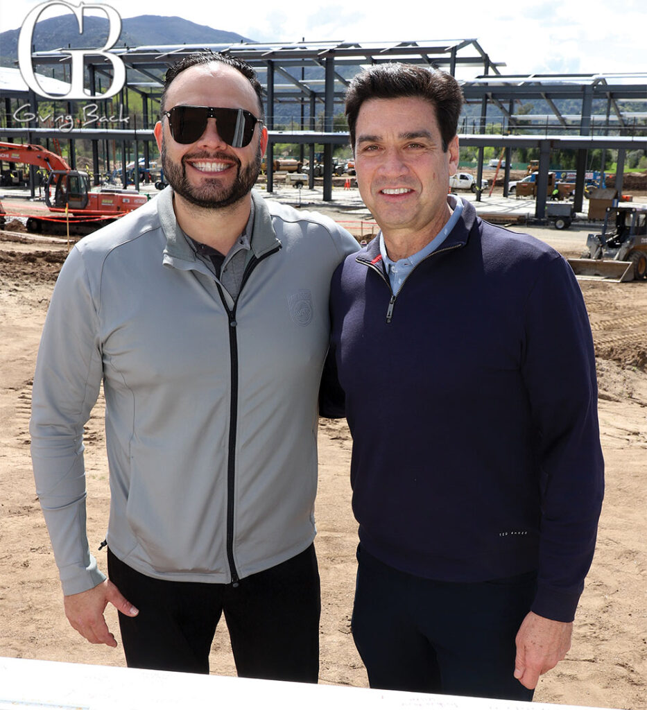 Cody Martinez and Tom Penn from San Diego FC celebrate the topping-off at the new training campus.