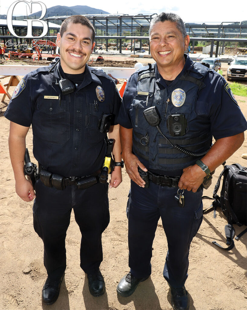 Officer Hernandez and Officer Miranda from San Diego FC celebrate the topping-off at the new training campus.