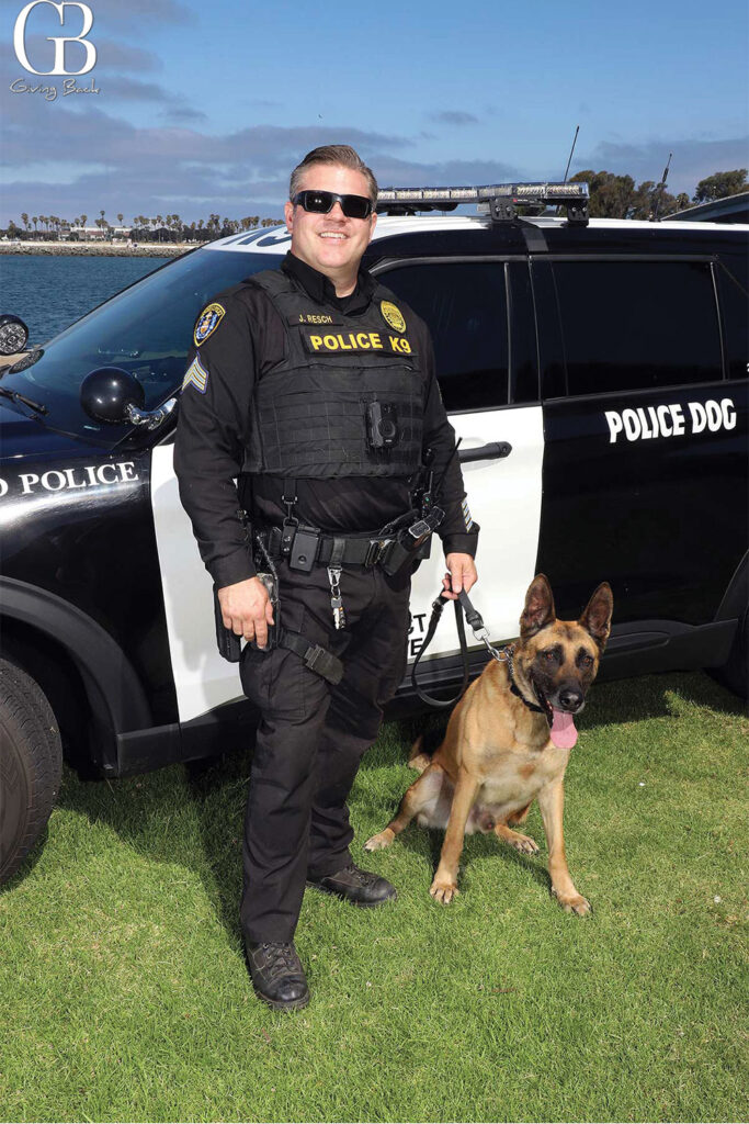 San Diego Police Officer with K9 and police car