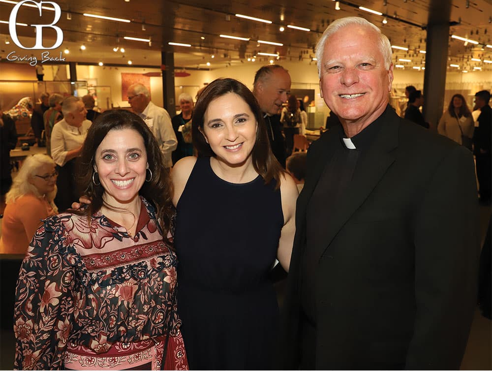 Andrea de Lucia Karla Perez and Father Michael Sinor