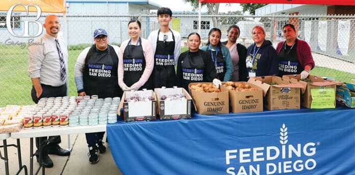 Principal Joe Prosapio (far left) with volunteers at Berry Elementary's first school pantry distribution