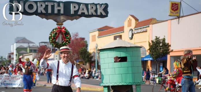 A marcher dressed as the Water Tower in The North Park Toyland Parade