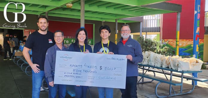 Wheelhouse Credit Union presents a grant to Sports4Kids
