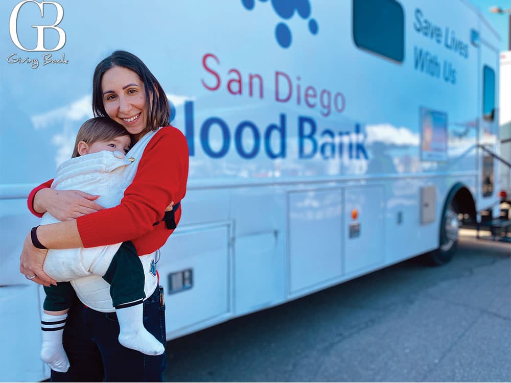 Blood recipient Christina and baby Archie at a recent blood drive +