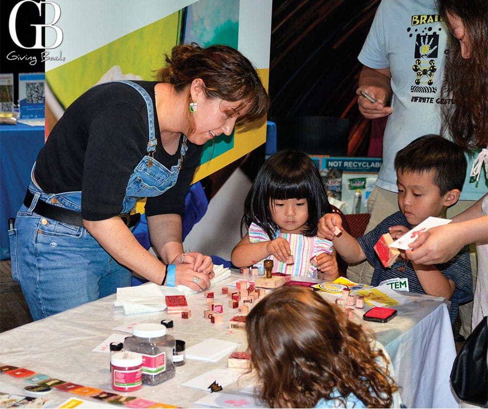 Children and adults crafting with stamps