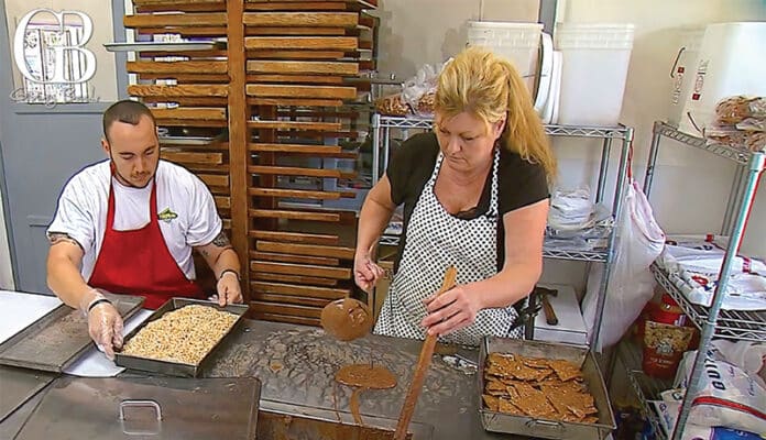 Dana Eacobellis and her son Joe at work in the kitchen of 104-year-old Wisteria Candy Cottage.