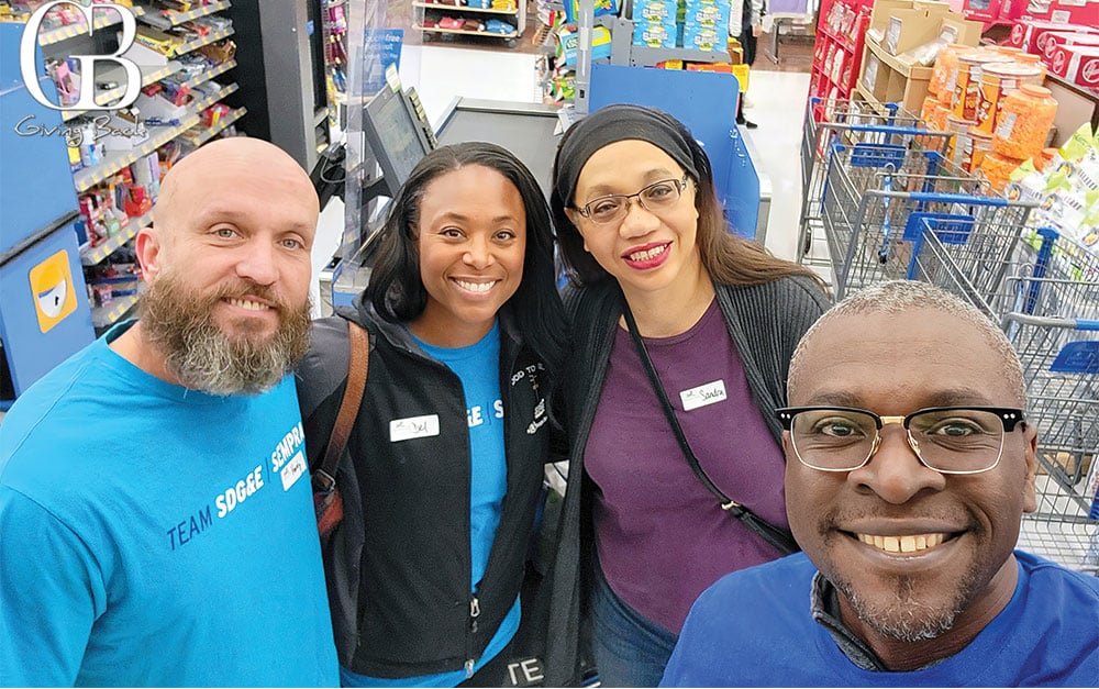 Jude on the right corner with his fellow SDGE colleagues shopping for the Holiday Drive