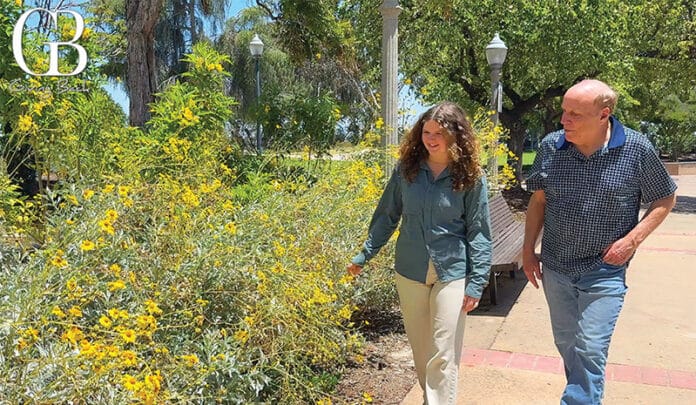 Savannah Stallings Walks Past Native Plants in the Garden of the Natural History Museum.
