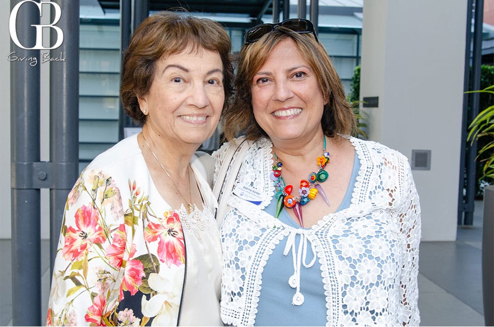 Anne-Samson-and-Sabrina-Kerbel - GB Magazine Anne Samson and Sabrina Kerbel'GB Giving Back' logo in the corner.