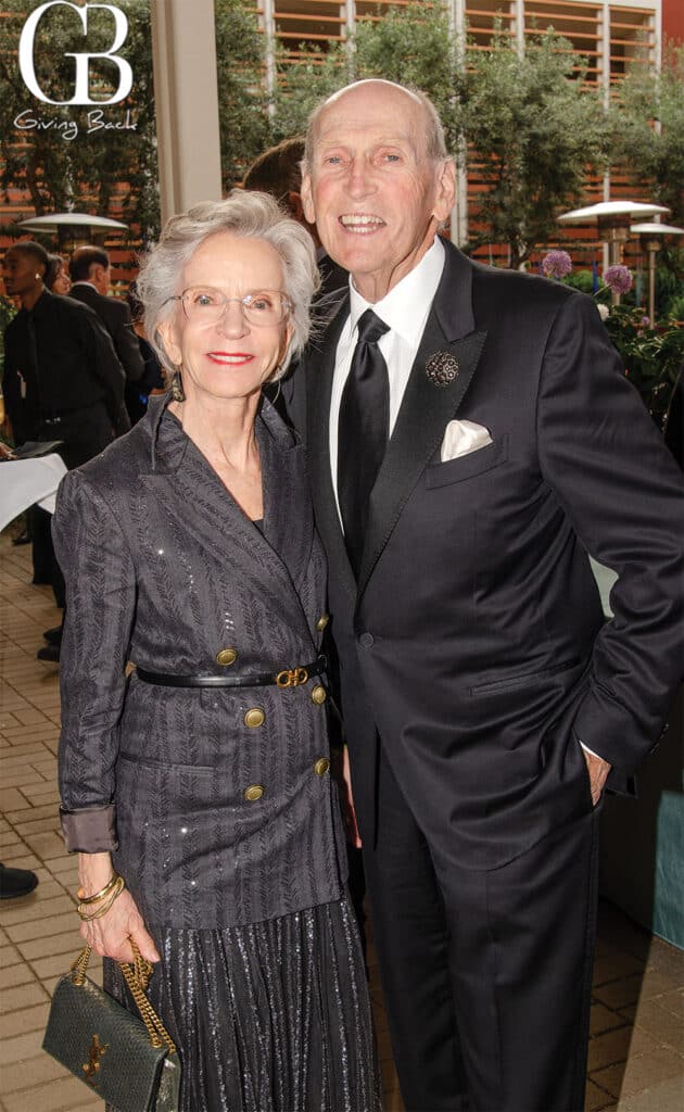 Carol Young and Leonard Kornreich'Giving Back' logo visible in the top-left corner.