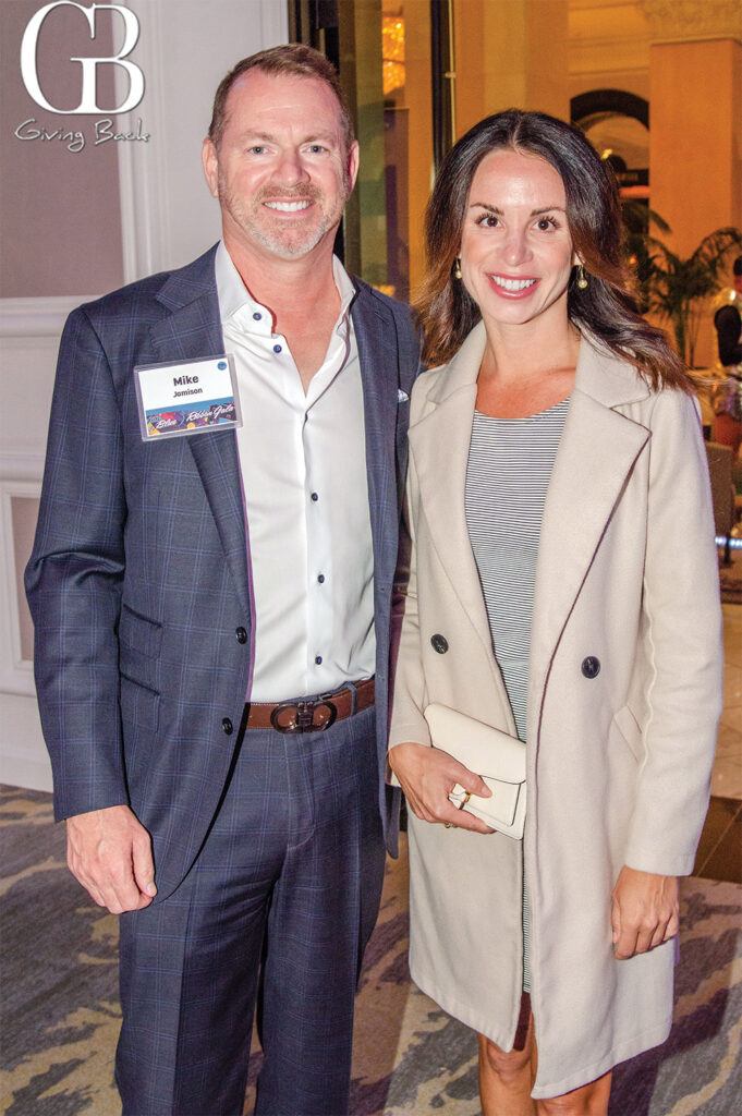 Mike Jamison and Kelley Jo'Giving Back' logo visible in the background.