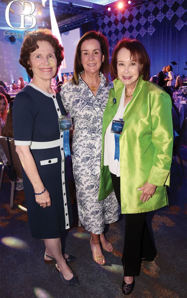 Carrie OBrien Kim Alessio and Clarice Perkins'Giving Back' logo in the background.