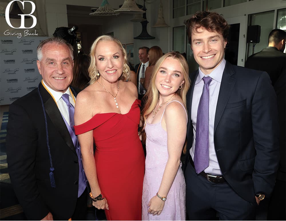 David-Crean-Heidi-Hutchison-Heather-Crean-and-Ryan-Crean - GB Magazine David Crean Heidi Hutchison Heather Crean and Ryan Crean'Giving Back' logo in the background.
