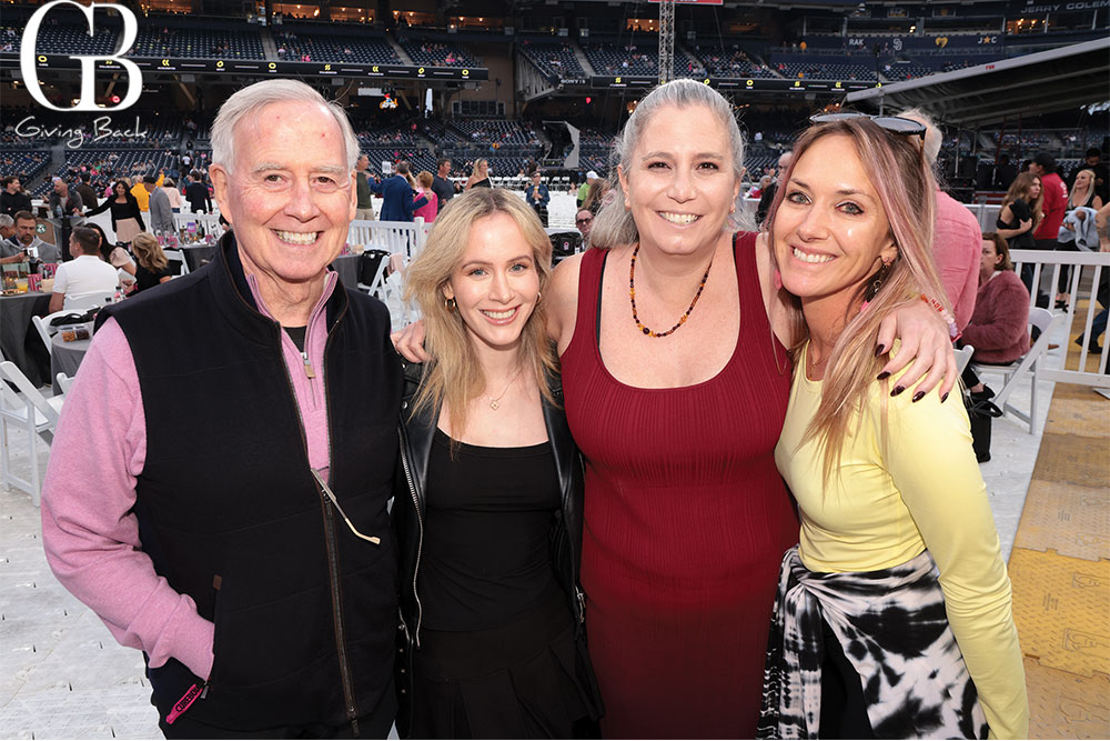 Jeff-Shannon-and-Kim-Partrick-with-Brooke-Barttelbort - GB Magazine Jeff Shannon and Kim Partrick with Brooke Barttelbort'Giving Back' visible in the corner.